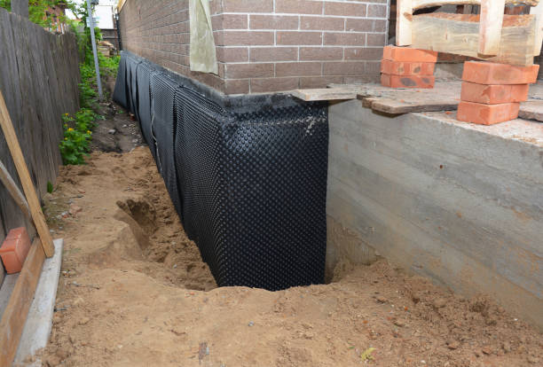 Happy homeowners after waterproofing job in Burgoon